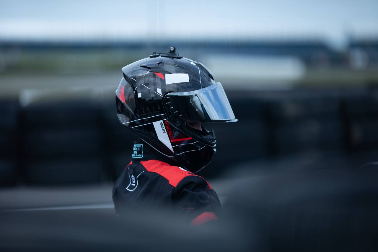 Kseniia sitting in a kart from tyre perspective